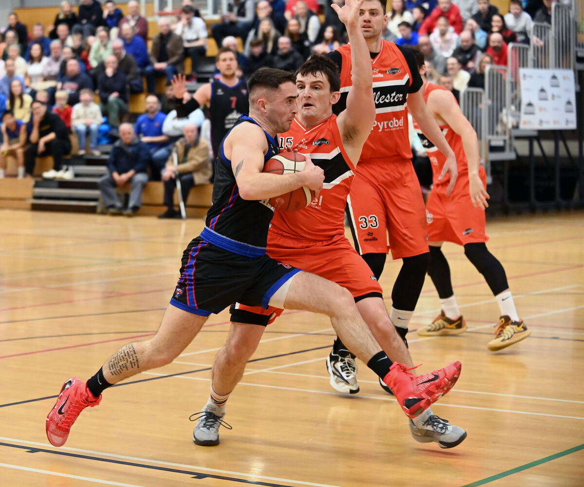 UCC Demons' James Hannigan takes on Killester's Ciaran Roe during the Men's Super League at The Mardyke Arena. Picture: Eddie O'Hare