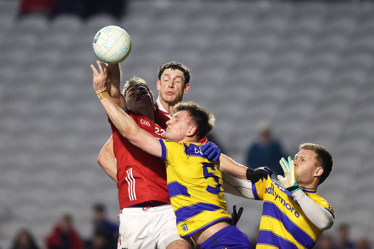 Cork's Ian Maguire and Shane Cunnane of Roscommon battle for possession.