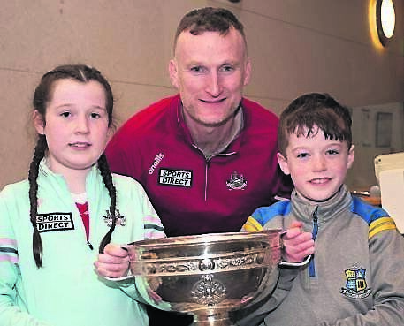 Former Cork senior footballer Nicholas Murphy with Adam and Holly Murphy from Carrigaline with the O’Duffy Cup at a recent Cork camogie Family Night at Curraheen Park. Former Cork senior footballer Nicholas Murphy with Adam and Holly Murphy from Carrigaline with the O’Duffy Cup at a recent Cork camogie Family Night at Curraheen Park.