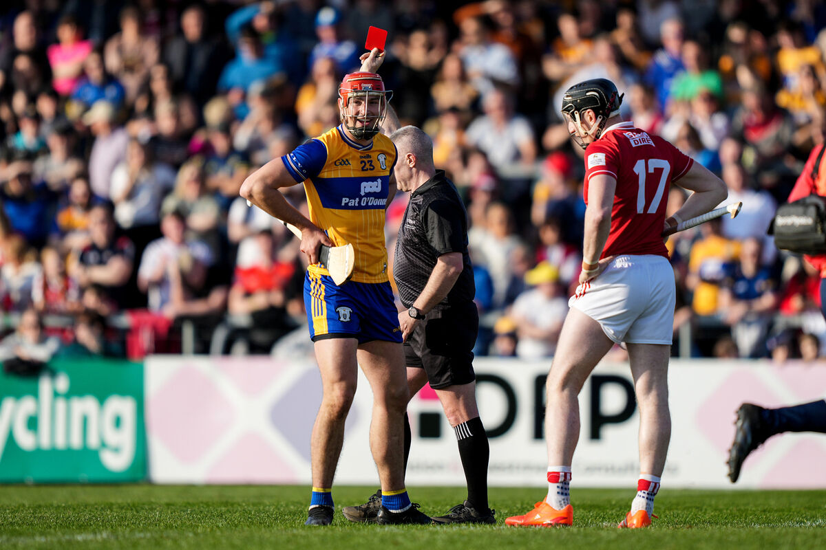 Referee Liam Gordon gives a red card to Peter Duggan of Clare. Picture: INPHO/James Lawlor