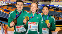 Mark English with his 800m bronze medal, Sarah Healy with her gold from the 3000m and Kate O’Connor with a bronze medal from the