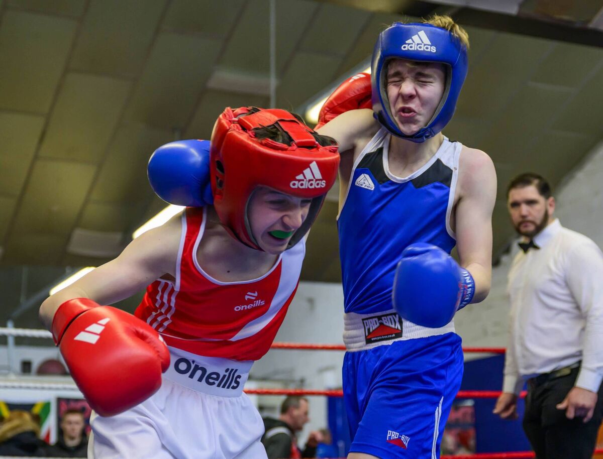 Rhys Crowley of Northside BC (Red) and Jack O’Sullivan of Muskerry BC trading punches during the Boy 3 54kg Final at the County Championships. Picture: Doug Minihane 