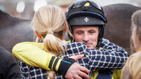 Sean Flanagan hugs the late Michael O’Sullivan’s girlfriend Charlotte Giles after winning on Marine Nationale 12/3/2025