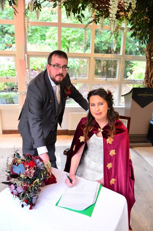 The bride's cloak featured wolf clasps. The bride's cloak featured wolf clasps.