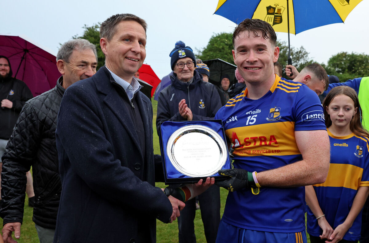Carrigaline's Éanna Desmond receiving the Player of The Match Award from Alan O'Brien of McCarthy Insurance Group following their win over Nemo Rangers in last year's FL Division 1 final at Shanbally. Picture: Jim Coughlan