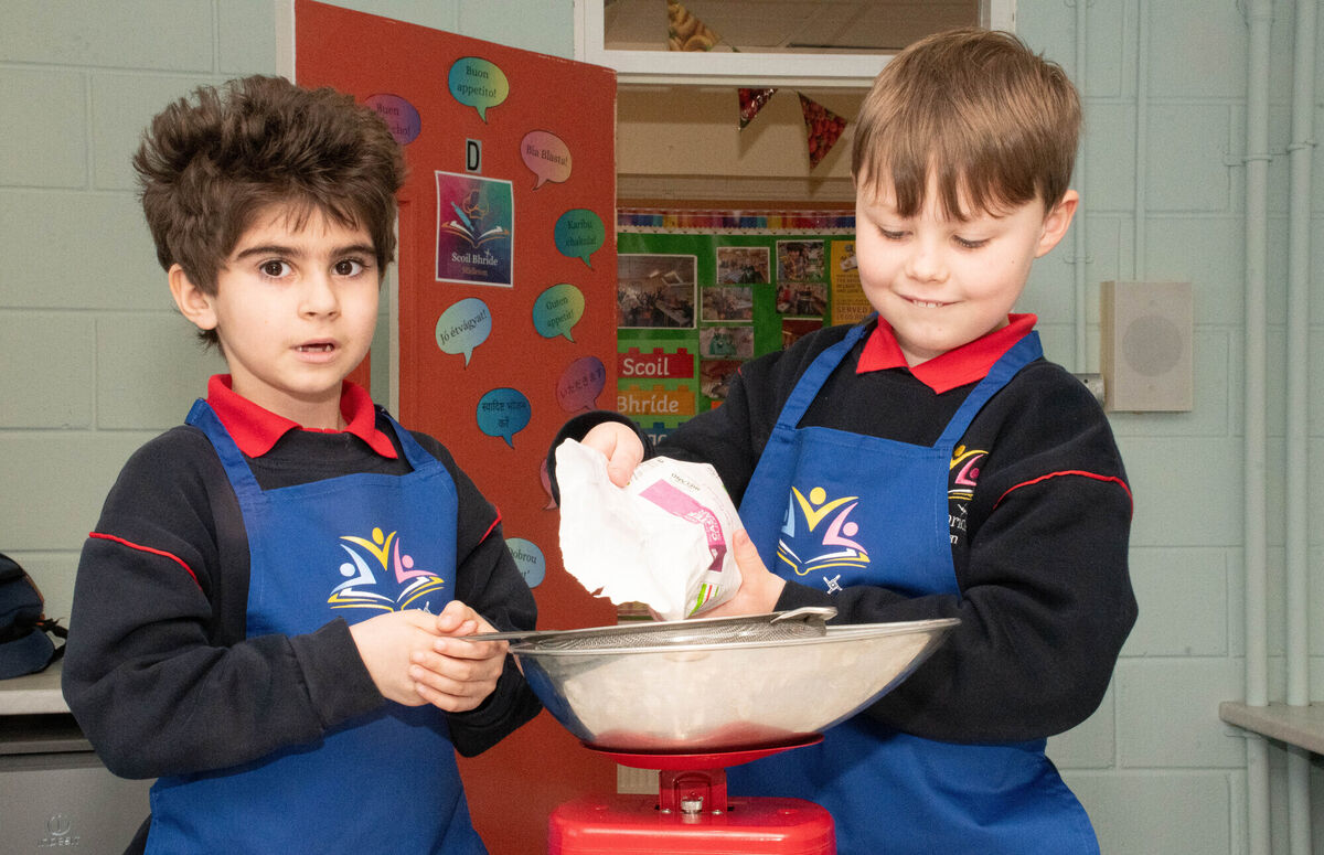 Amar and Ronan measuring sugar in the new school kitchen in Scoil Bhride Midleton. Picture: Howard Crowdy