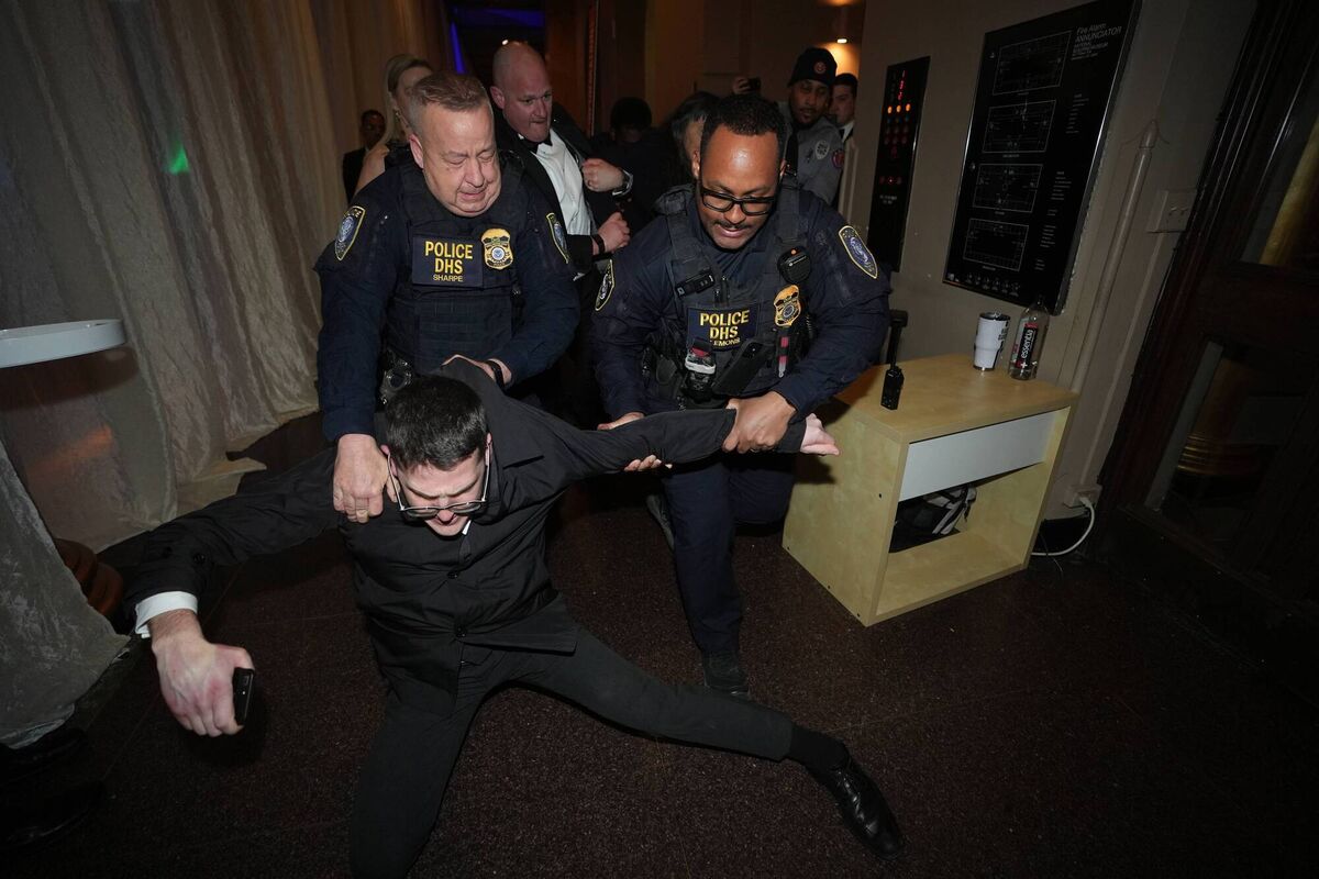 Isaac Burke is removed from the Ireland Fund’s dinner (Niall Carson/PA) Isaac Burke is removed from the Ireland Fund’s dinner (Niall Carson/PA)