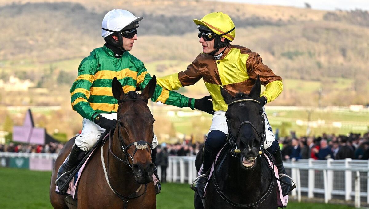 Mark Walsh, aboard Inothewayurthinkin, left, is congratulated by jockey Paul Townend, aboard Galopin Des Champs, after winning the Boodles Cheltenham Gold Cup. Picture: David Fitzgerald/Sportsfile
