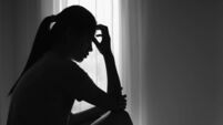 Young  women sitting in dark room feeling pain with life problem.  suffering from husband violence, Stop violence against and se