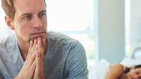 Man, thinking and married in bedroom at house with stress, anxiety and problem of secret from cheating on sleeping woman. Frustr