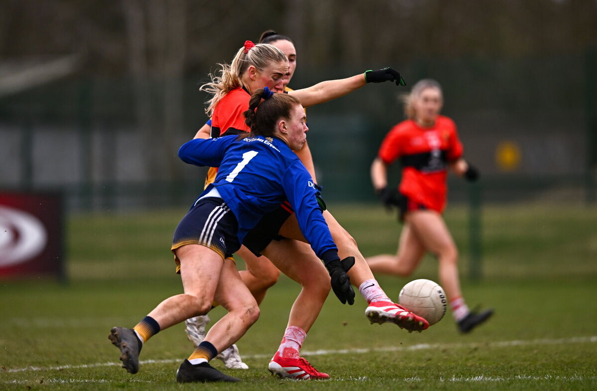 Emma Morrissey of UCC scores her side's goal despite the tackle of DCU Dóchas Éireann goalkeeper Robyn Murray. Picture: Ben McShane/Sportsfile Emma Morrissey of UCC scores her side's goal despite the tackle of DCU Dóchas Éireann goalkeeper Robyn Murray. Picture: Ben McShane/Sportsfile
