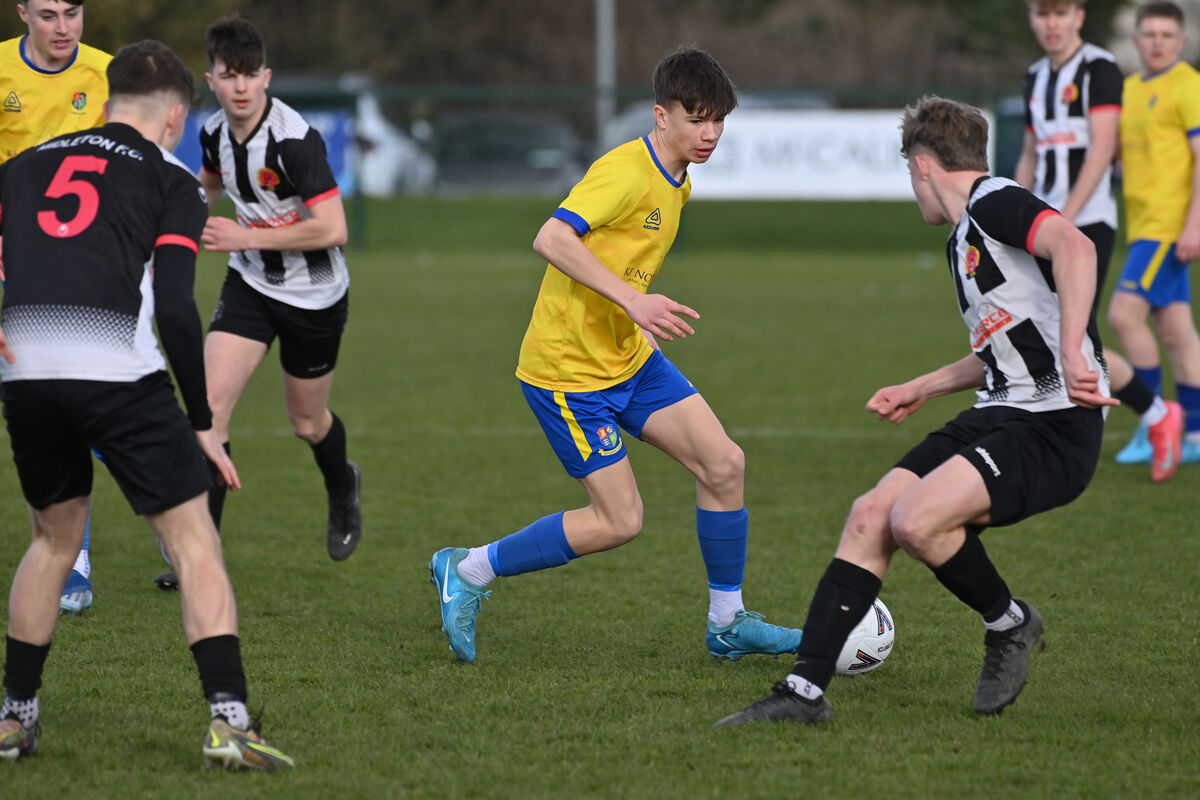  Alex O'Connell, Carrigaline United, looking to go past Dara Birdthistle, Midleton. Picture: Dan Linehan