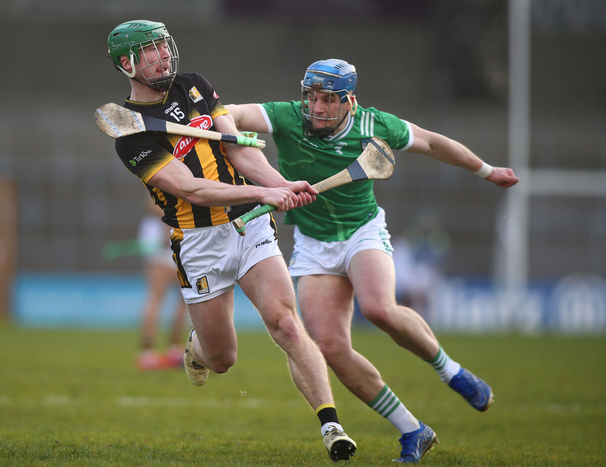 Kilkenny's Martin Keoghan scores a point despite the attention of Limerick's Mike Casey during Saturday's Allianz HL Division 1A game at UPMC Nowlan Park. Picture: Inpho/Ken Sutton