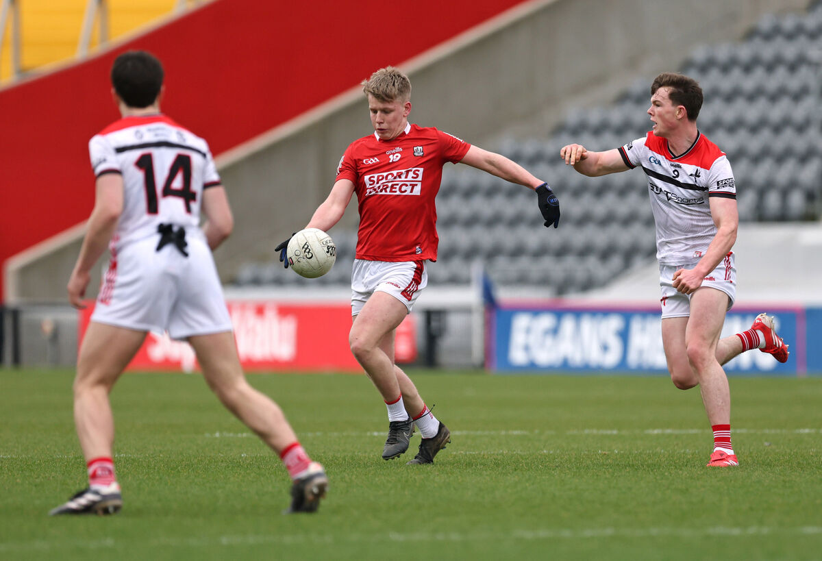 Dara Sheedy, Cork U20, shoots as Keelan Martin, Louth U20 looks to block. Picture: Jim Coughlan. Dara Sheedy, Cork U20, shoots as Keelan Martin, Louth U20 looks to block. Picture: Jim Coughlan.