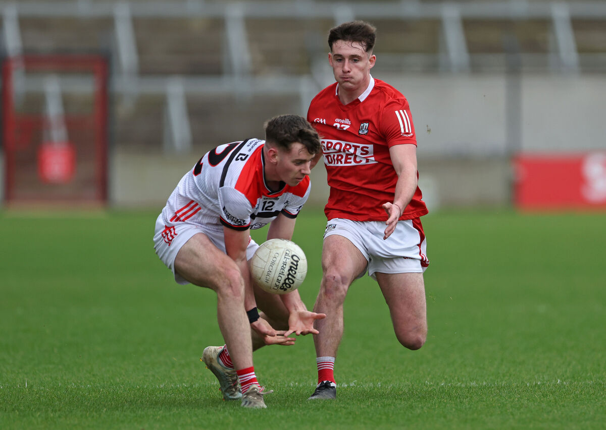 Odhran Foley, Cork U20 tries to tackle Pierce Grimes Murphy, Louth U20. Picture: Jim Coughlan. Odhran Foley, Cork U20 tries to tackle Pierce Grimes Murphy, Louth U20. Picture: Jim Coughlan.
