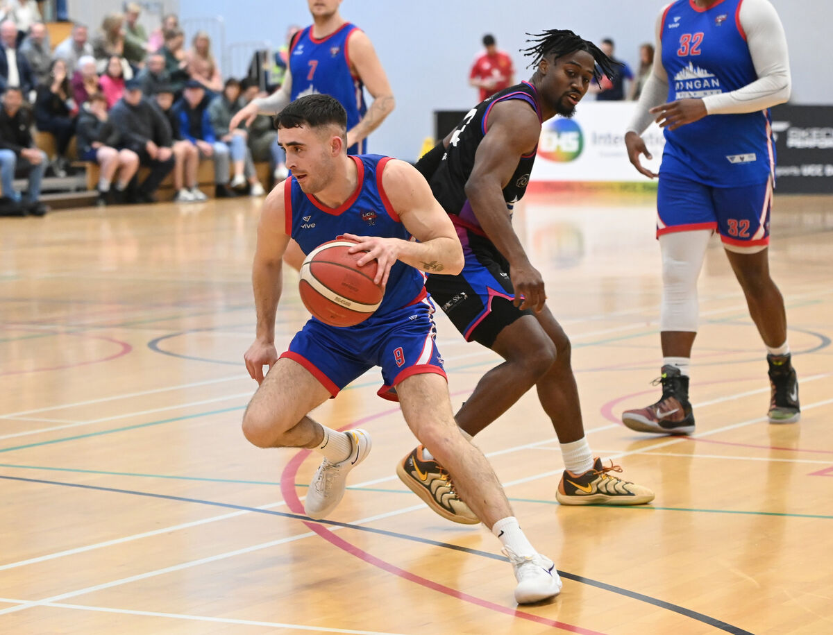 UCC Demons' James Hannigan goes past Eanna's Tyland Crawford during the Men's Super League at The Mardyke Arena . Picture: Eddie O'Hare