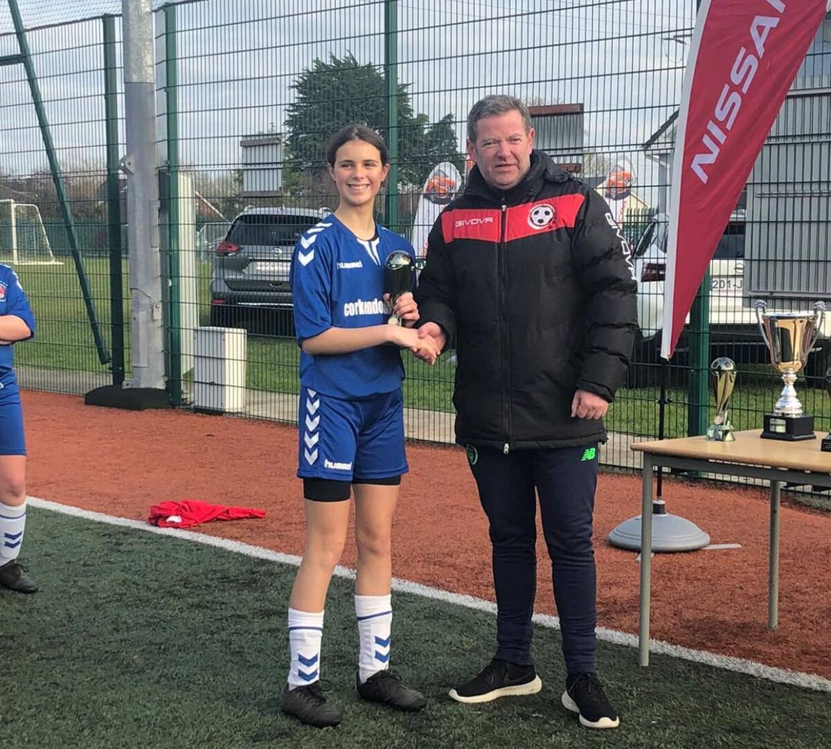 Wilton captain Alix Mendez receives the Player of the match award from Fergal O'Neill, Regional FC, Limerick.