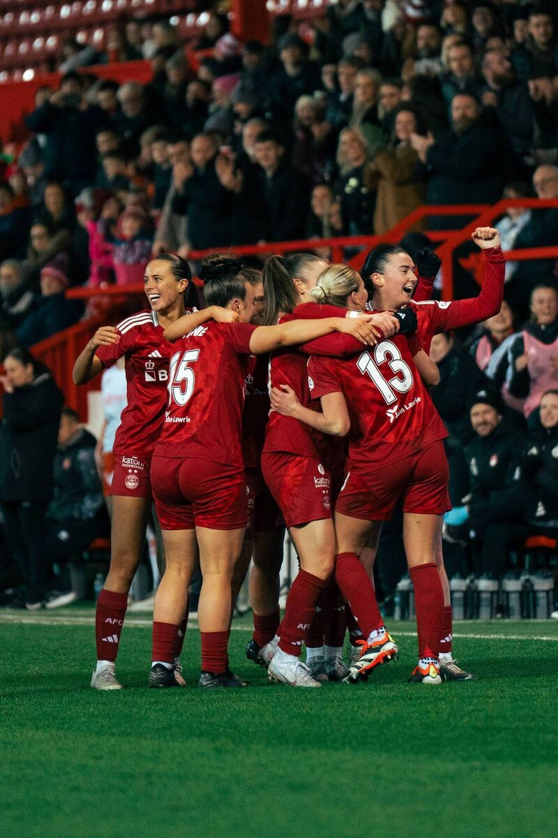 Alix Mendez, on the left celebrates a goal with her new teammates at an Aberdeen game recently.