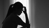 Young  women sitting in dark room feeling pain with life problem.  suffering from husband violence, Stop violence against and se