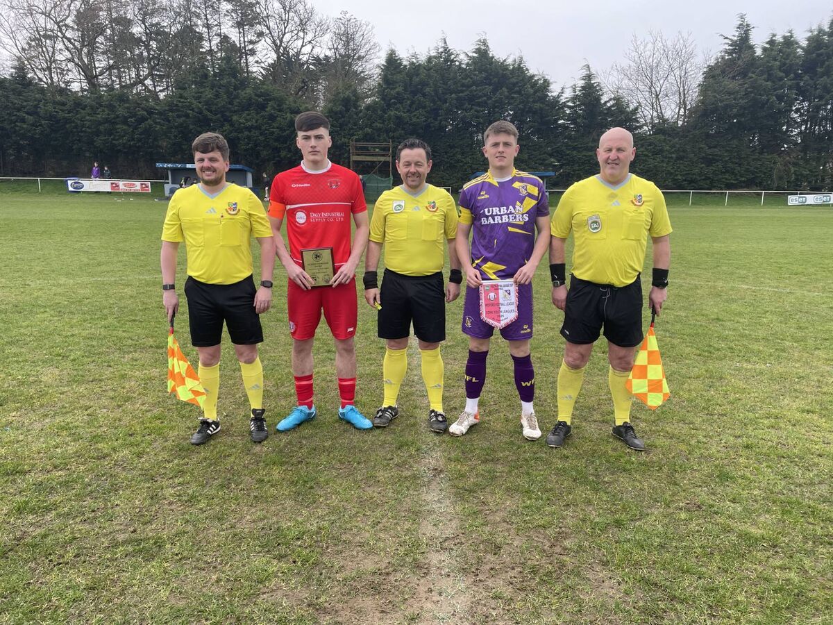 Assistant referee Eric McCann, Cork Youth League captain Kealan Crowe, referee Daniel Whelan, Wexford Football League captain Cian Redmond and Assistant referee Derek Stafford before the FAI Inter-League semifinal at Hollygrove in Wexford