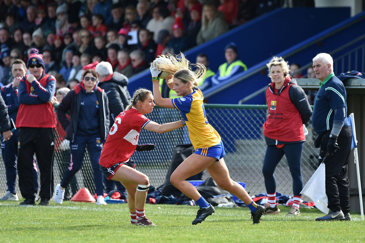  Amy McDonagh putting pressure on Clare's Emer Burke. Picture: Dan Linehan