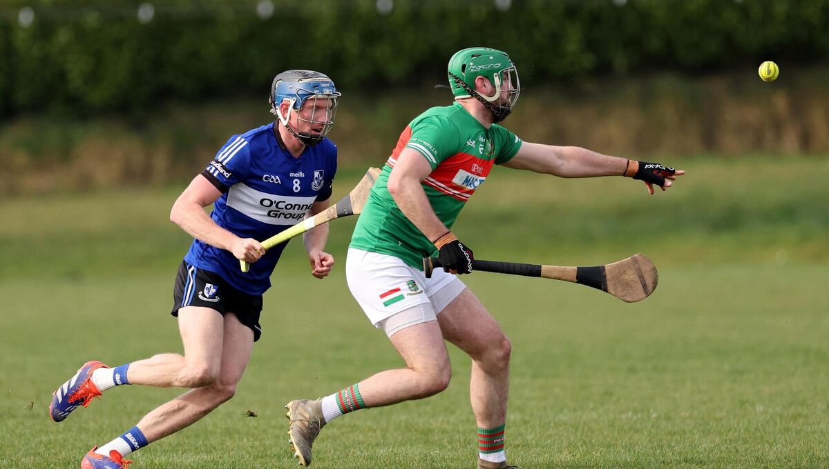 Cian Darcy, Sarsfields in action against Dan Harrington, Fr O'Neills. Picture: Jim Coughlan.