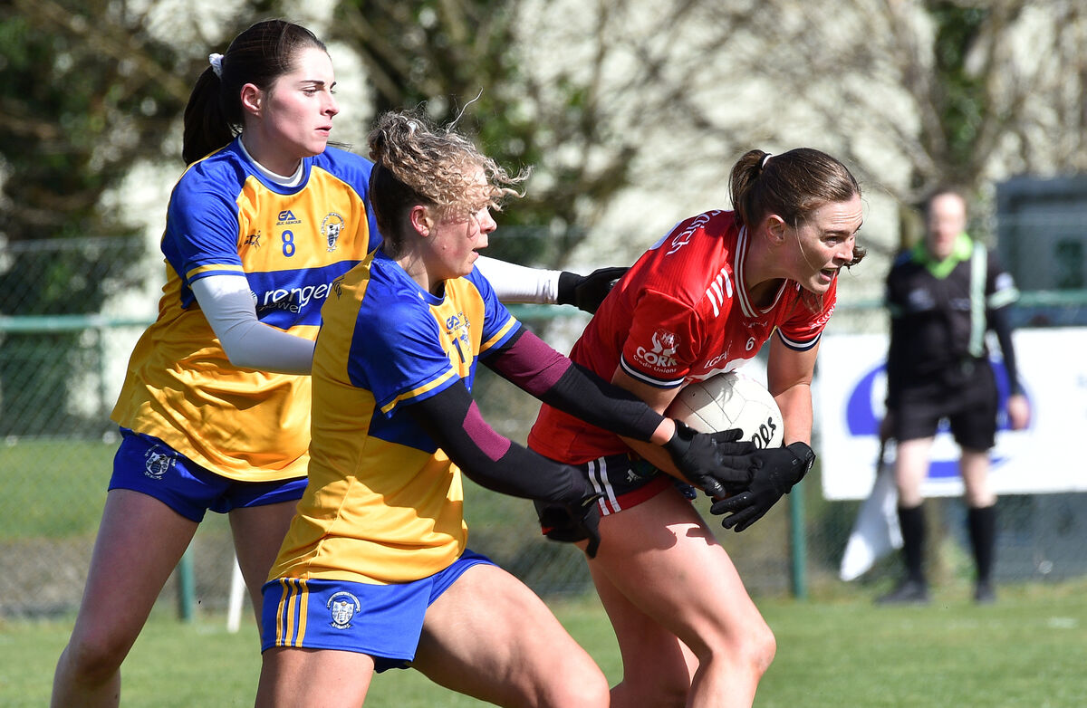 Shauna Cronin, Cork, is tackled by Clare players Caoimhe Harvey and Megan Downes during their league clash at Ballyvourney. Picture: Dan Linehan