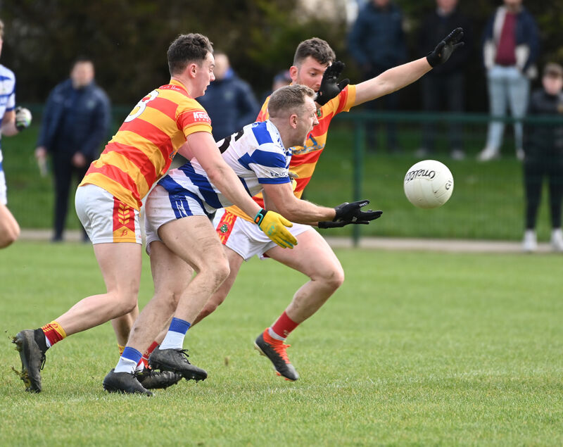Castlehaven's Michael Hurley is tackled by Newcestown's Eoghan Collins and James Kelleher during the McCarthy Insurance Group SFL Division 1 game at Newcestown. Picture: Eddie O'Hare Castlehaven's Michael Hurley is tackled by Newcestown's Eoghan Collins and James Kelleher during the McCarthy Insurance Group SFL Division 1 game at Newcestown. Picture: Eddie O'Hare