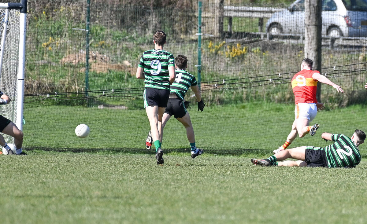  Eire Og midfielder Mark Griffin crashes the ball to the Douglas net, during their Senior Football League clash at Douglas. Picture: David Keane.