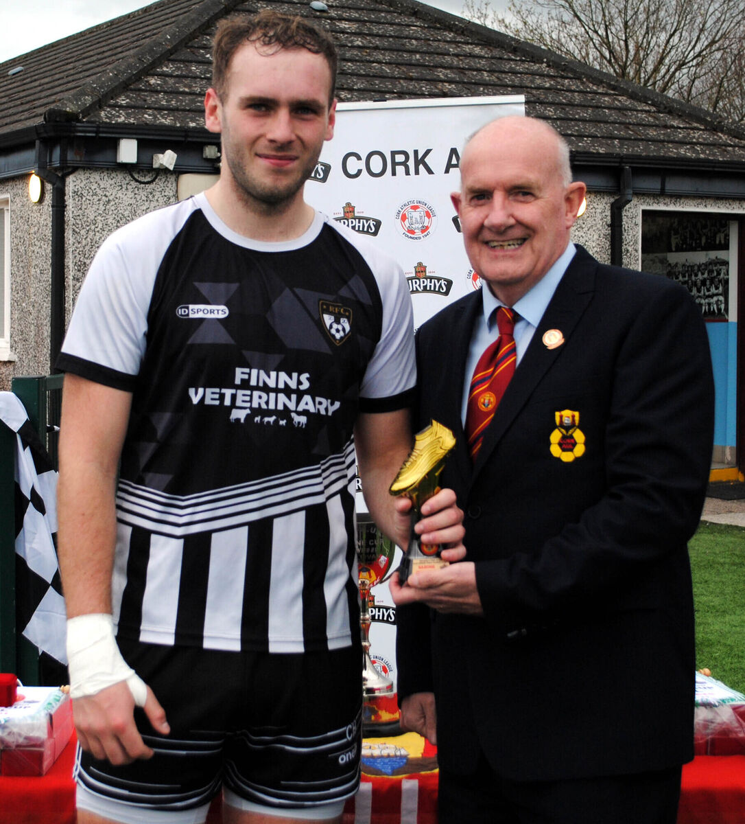 Rathcormac's Cian Hogan is presented with the man of the match award (Sponsored by Gary McCarthy Trophies) by Dan O'Flynn (Cork AUL).