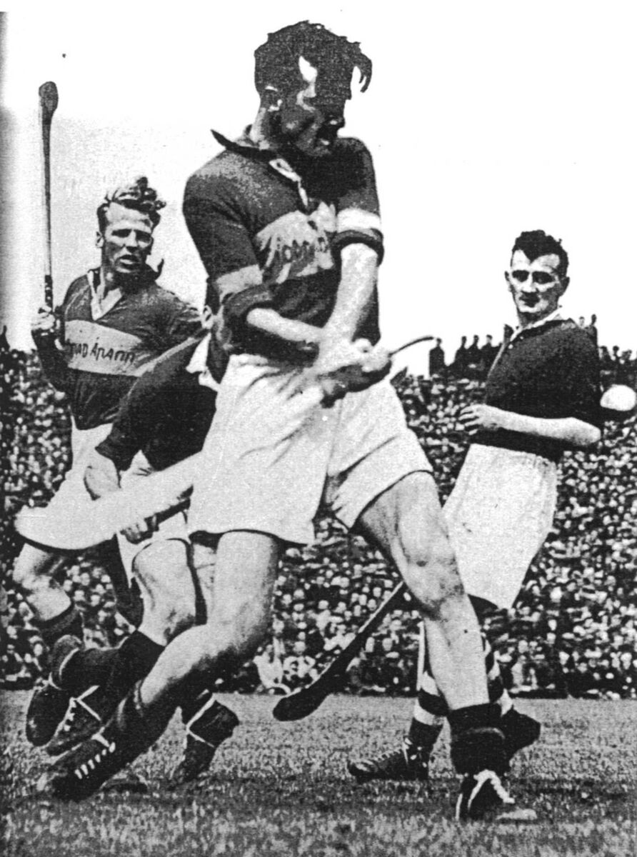 John Doyle in action for Tipperary against Cork in the 1953 Munster final. 