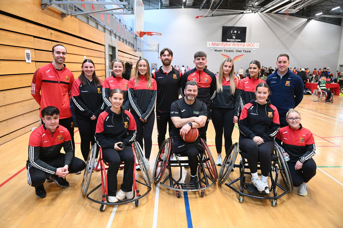  (front middle) Paul Ryan, IWA-Sport Development Officer with (left rear) Conor Philpott, Lecturer and (right rear) Diarmuid Lester, lecturer with B.Ed. Physical Education, Sports Studies and Arts students at the Wheelchair Basketball4All event for transition year students at Mardyke Arena, UCC on Thursday 13th March 2025. The event is in collaboration with the B.Ed. Physical Education, Sports Studies and Arts programme in University College Cork and Irish Wheelchair Association Sport, UCC Sport and the Mardyke Arena. Pic Larry Cummins