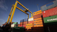 Shipping containers are seen stacked up