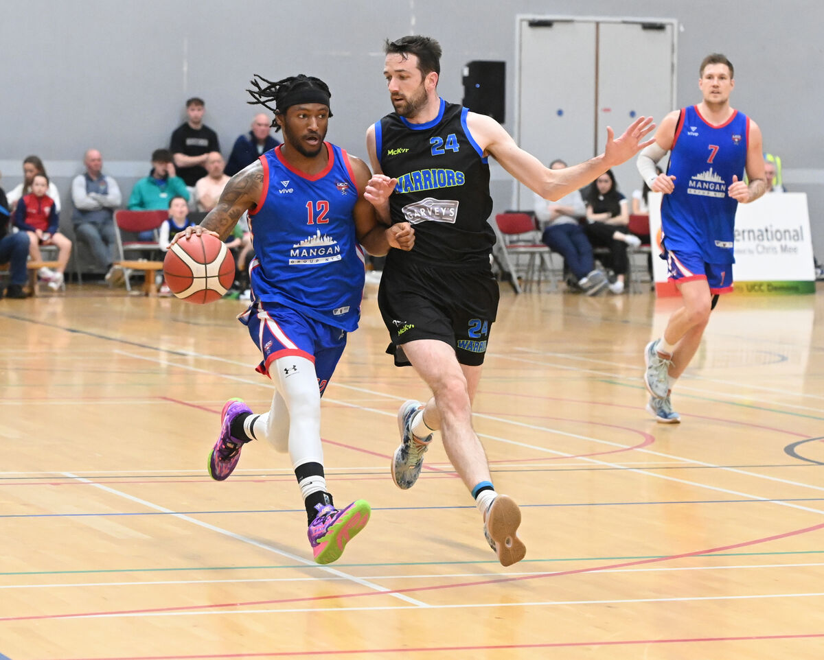 UCC Demons' Patrick Robinson running at Garvey Tralee Warriors' Eoin Quigley. Picture: Eddie O'Hare UCC Demons' Patrick Robinson running at Garvey Tralee Warriors' Eoin Quigley. Picture: Eddie O'Hare