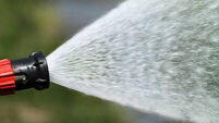 stream of water from a fire hose