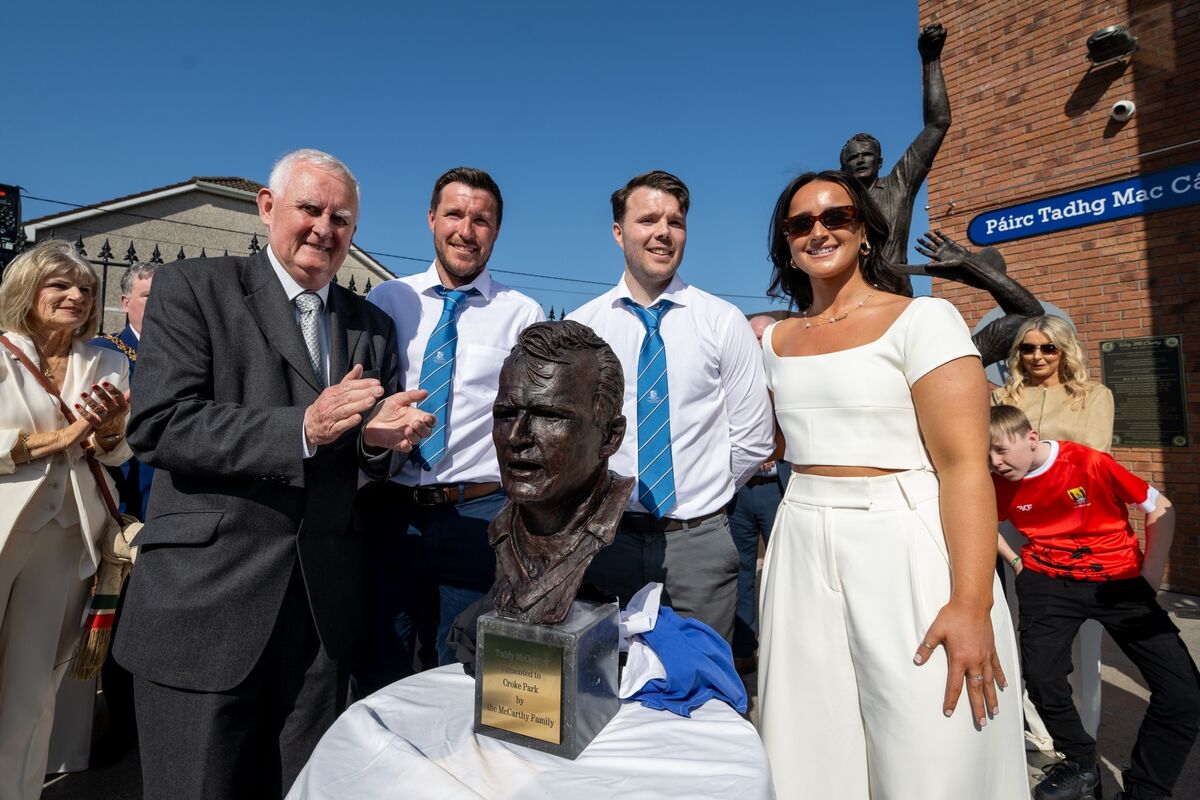 Teddy McCarthy's children Cian, Niall and Sinéad picture with former GAA President Christy Cooney at the unveiling of his statue at the newly renamed Páirc Tadhg Mac Cárthaigh. Picture: Chani Anderson Teddy McCarthy's children Cian, Niall and Sinéad picture with former GAA President Christy Cooney at the unveiling of his statue at the newly renamed Páirc Tadhg Mac Cárthaigh. Picture: Chani Anderson