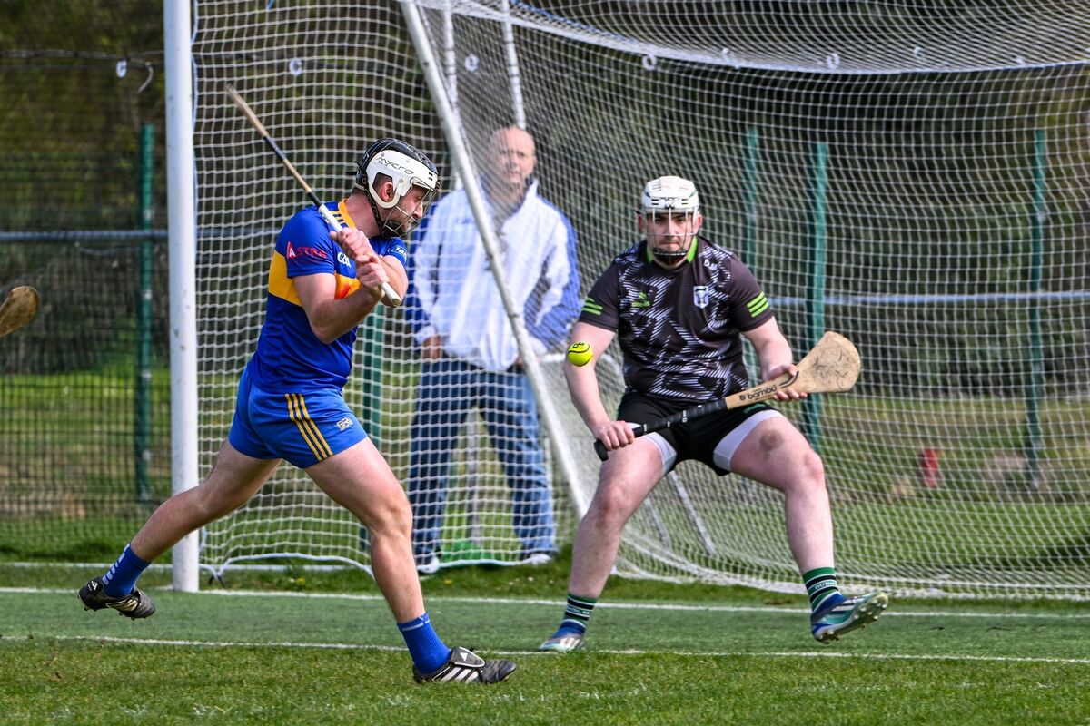 Carrigaline’s David Drake lines up a shot on goal under pressure from Douglas goalkeeper Donal Maher. Picture: Chani Anderson.**