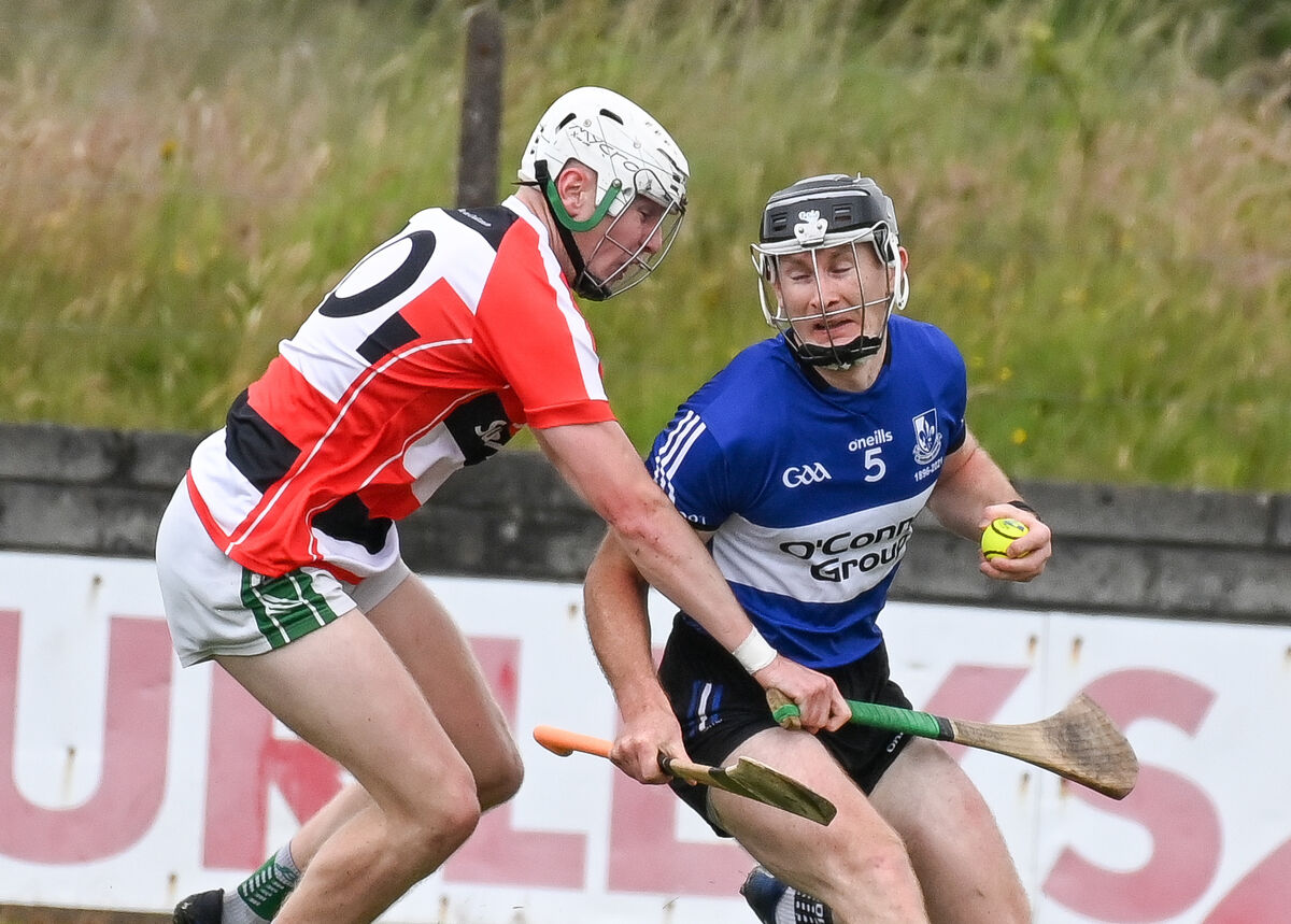  Sarsfields' Bryan Murphy is tackled by Ballincollig's Stephen Wills, during their SHL clash played in Ballinacurra last year. Picture: David Keane.