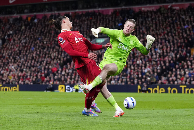 Liverpool's Darwin Nunez (left) and Everton goalkeeper Jordan Pickford collide during their Premier League match at Anfield, Liverpool. Picture: Peter Byrne/PA Wire