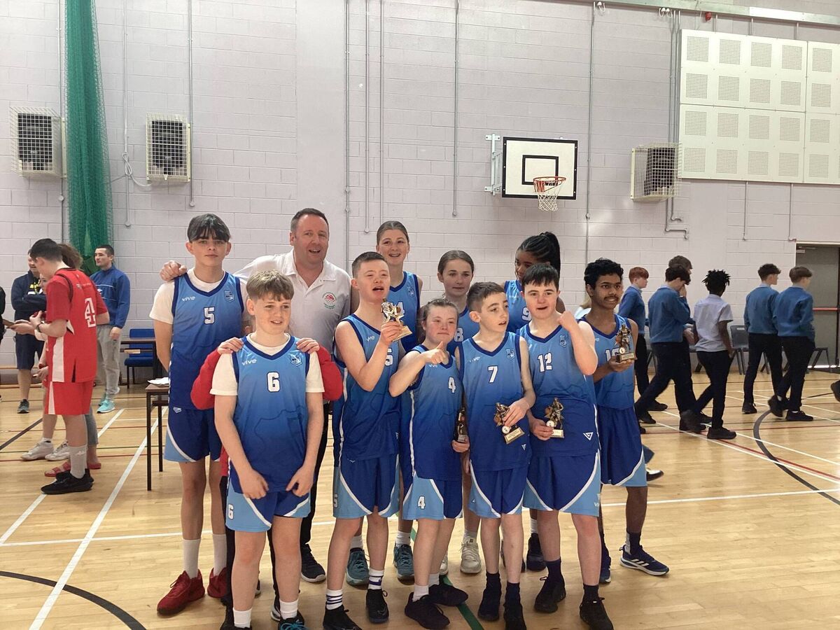 Pa Curran with his students from Colaiste Pobail Bheanntrai after their mixed ability basketball game at their school gym. 