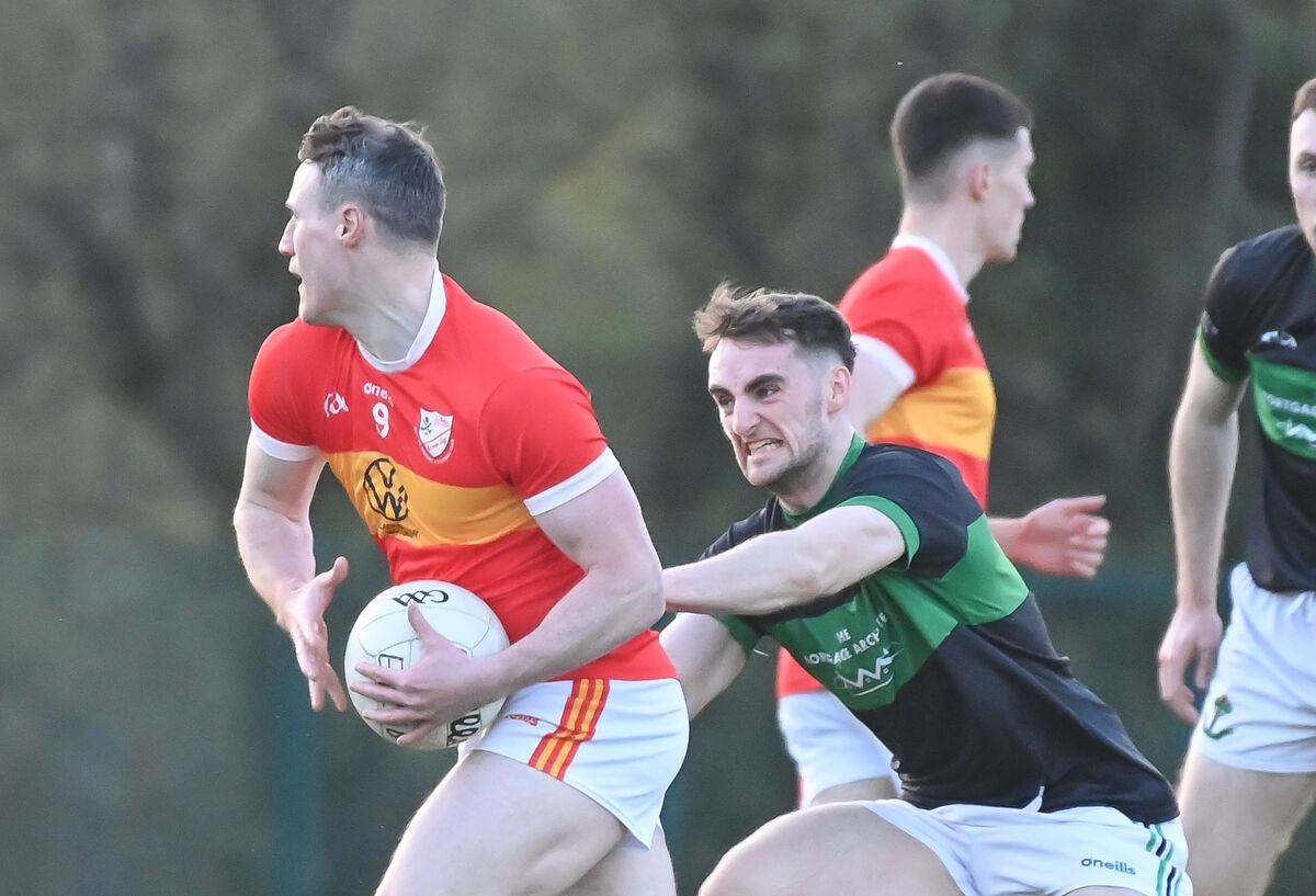 Éire Óg's Mark Griffin tries to get away from Nemo Rangers' Conor Shalloe. Picture: David Keane Éire Óg's Mark Griffin tries to get away from Nemo Rangers' Conor Shalloe. Picture: David Keane