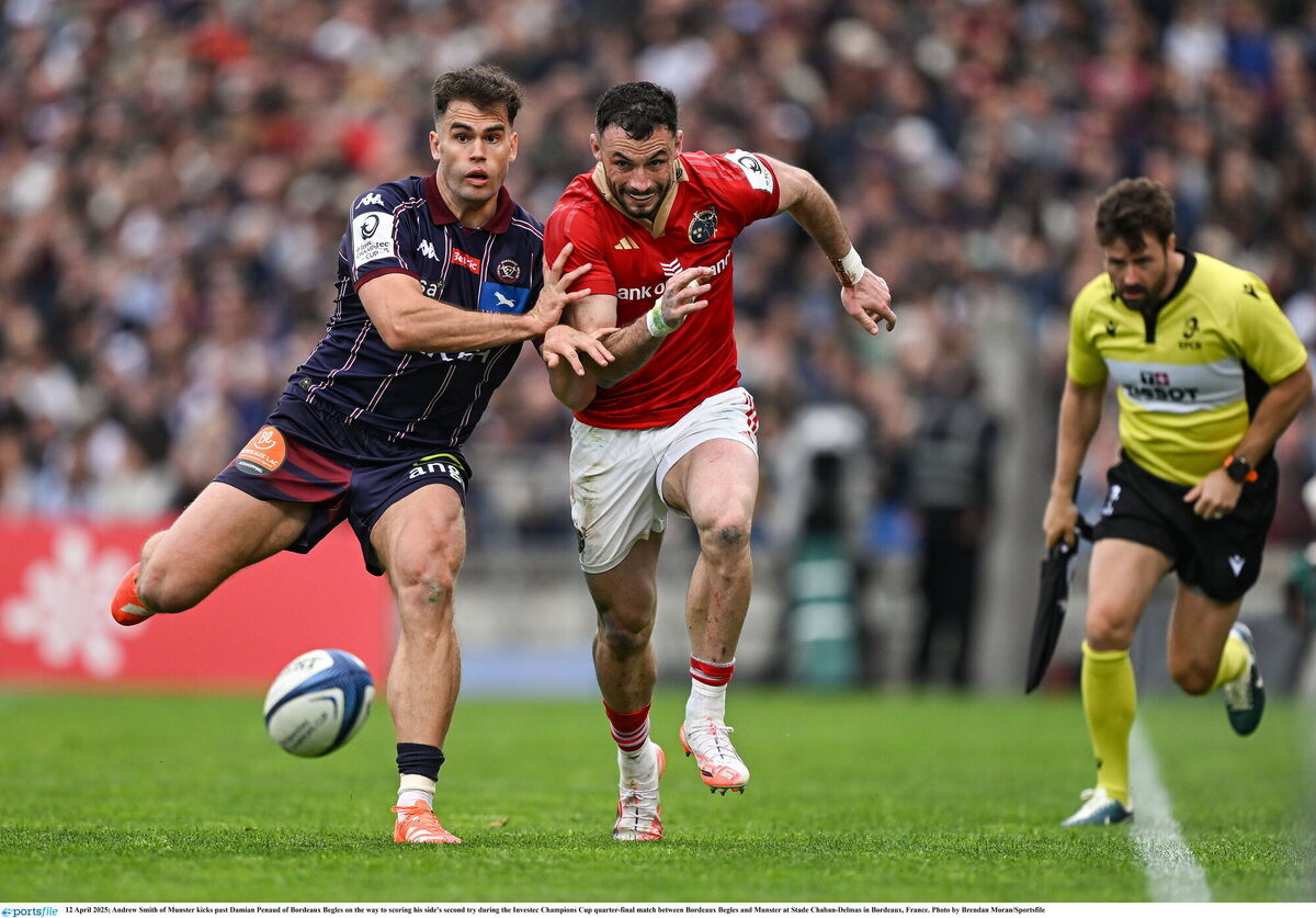 Andrew Smith of Munster kicks past Damian Penaud of Bordeaux Begles on the way to scoring his side's second try. Picture: Brendan Moran/Sportsfile