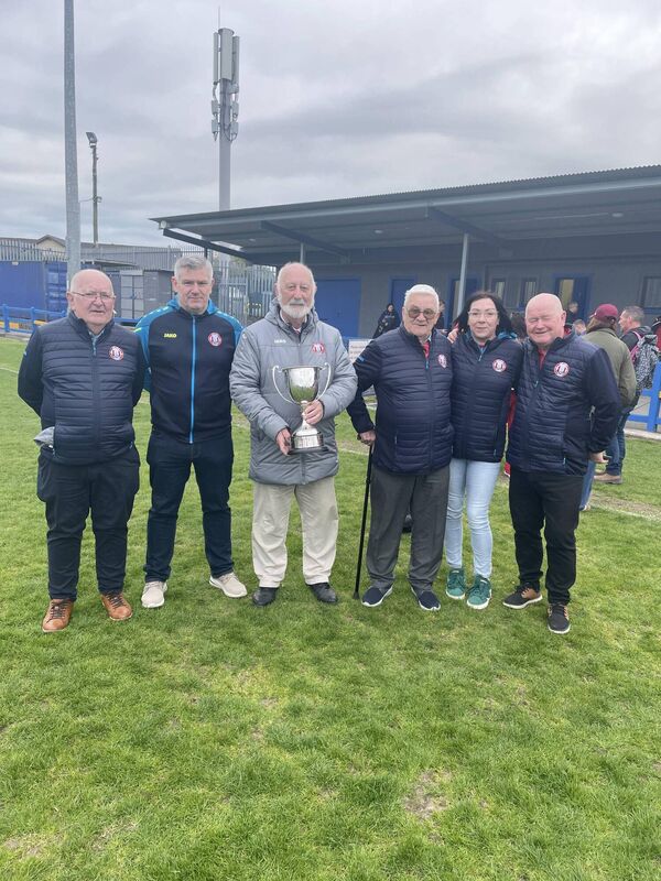 Members of the Cork Youth League committee celebrating with the FAI Inter-League cup in Fairview Rangers pitch last Saturday.