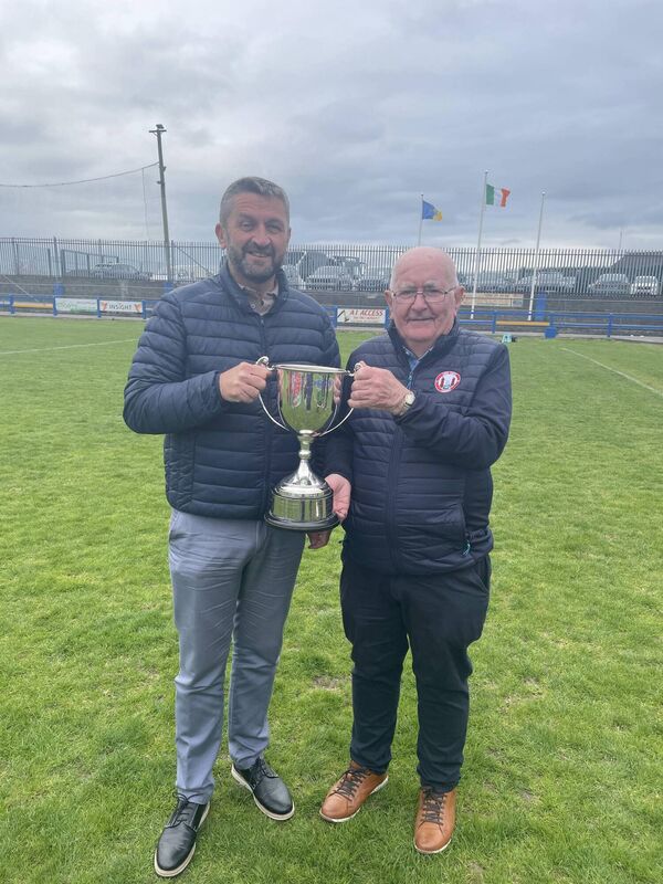 Founder members of the Cork Youth League Mr John Finnegan and Mr Peadar O’Leary with the FAI Inter-League cup after the final at Fairview Rangers pitch last Saturday evening. 