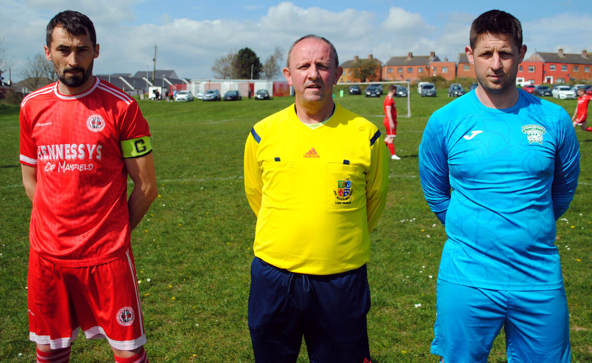 Village United captain Colin Hickey (left), with Coachford's Steven Murray, accompanied by referee Paul Bowdren. Village United captain Colin Hickey (left), with Coachford's Steven Murray, accompanied by referee Paul Bowdren.