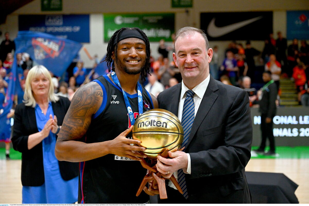 Patrick Robinson is presented the MVP by Basketball Ireland CEO John Feehan, Picture: Tyler Miller/Sportsfile