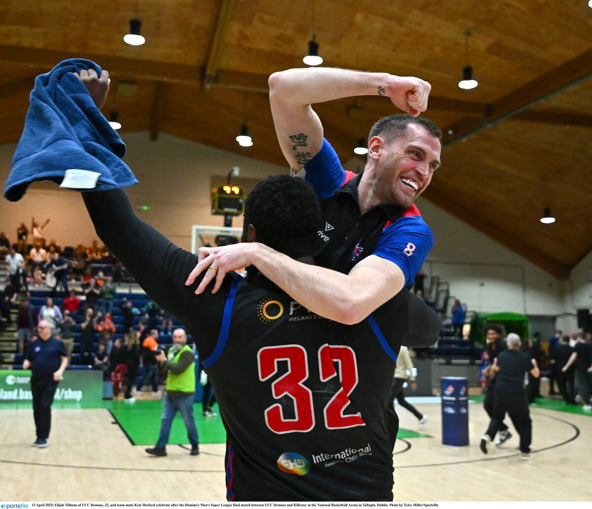 Elijah Tillman of UCC Demons, 32, and team-mate Kyle Hosford celebrate after. Picture: Tyler Miller/Sportsfile