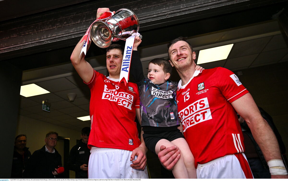 Cork captain Robert Downey, left, and teammate Patrick Horgan, with his son Jack, and the cup after the Allianz Hurling League Division 1A final match between Tipperary and Cork. Picture: Brendan Moran/Sportsfile