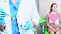 Cytobrush for sampling endocervical cells in doctor hands during PAP test on woman patient in gynecologist's office. PAP test, c