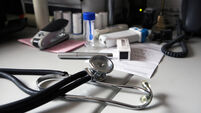A doctor's desk at a general practitioner's surgery. UK.